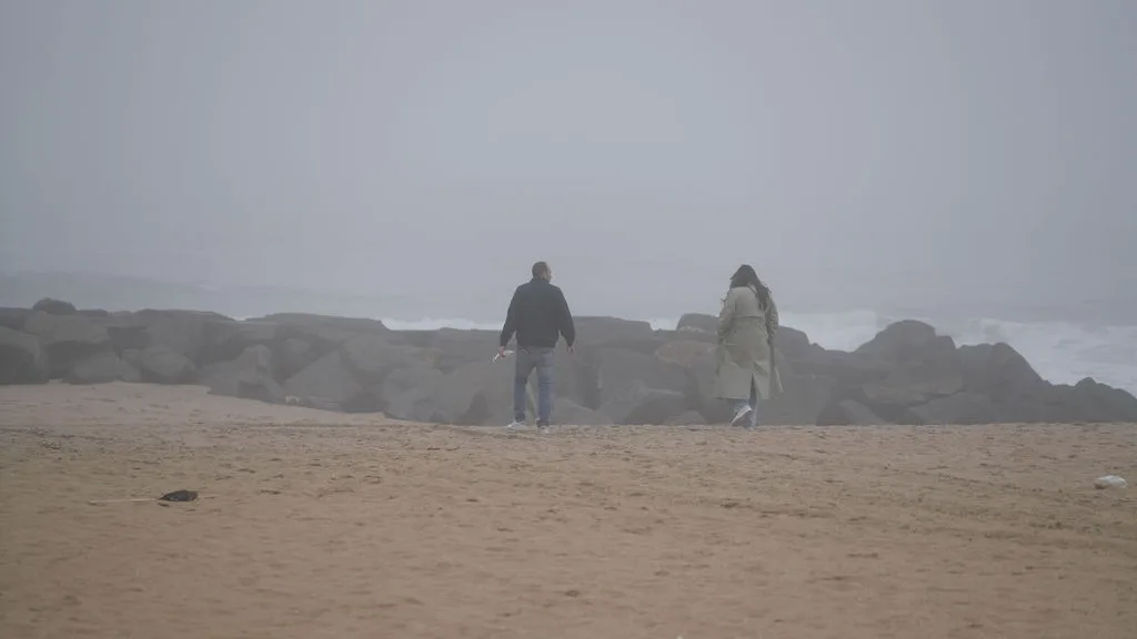 Walking back down the empty beach beside the jetty, newly engaged — New Jersey shore