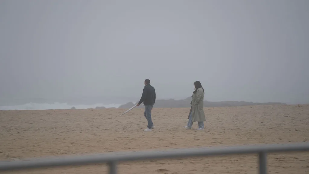 Hand in hand, they walk back into the fog the way they came — the closing frame of a New Jersey proposal story by Maximus Visions